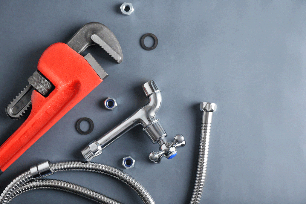 plumbing tools laying on gray background plumber conway sc myrtle beach sc 