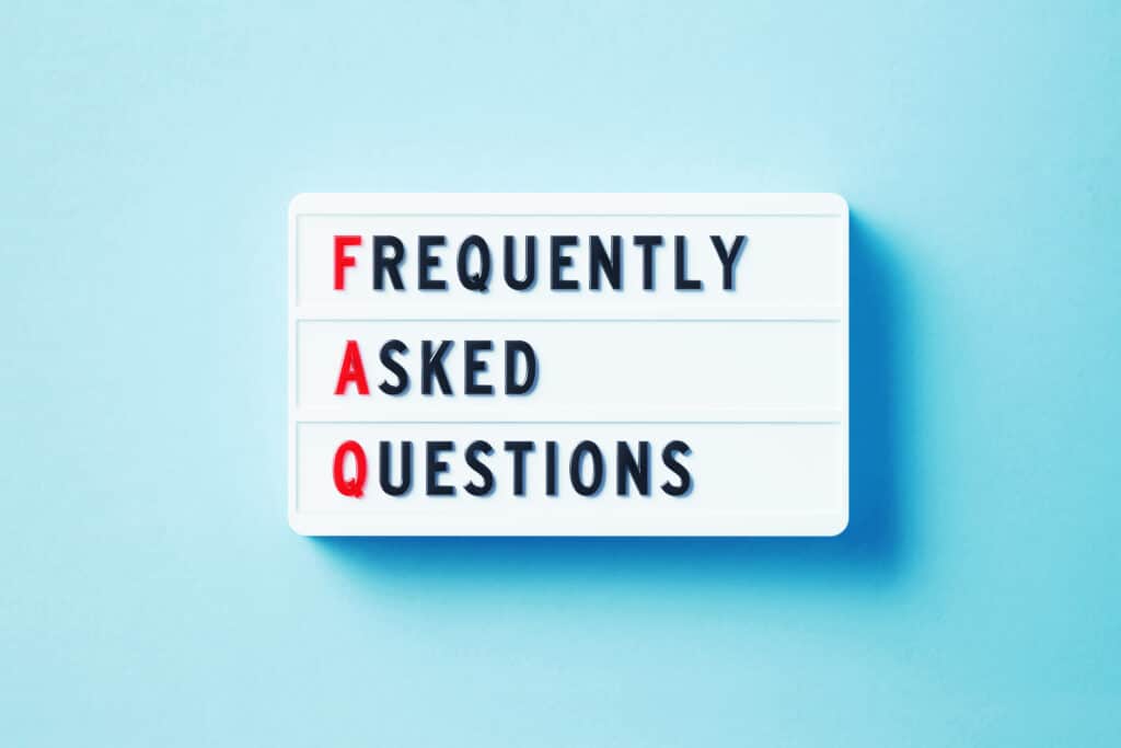 Frequently Asked Questions written white lightbox sitting on blue background. Horizontal composition with copy space. FAQs About Plumbing Service In Myrtle Beach, SC
